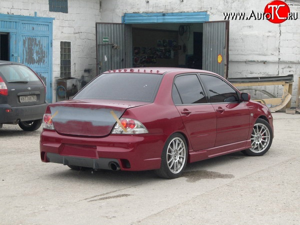 14 299 р. Задний бампер Evo Mitsubishi Lancer 9 1-ый рестайлинг седан (2003-2005) (Неокрашенный)  с доставкой в г. Москва