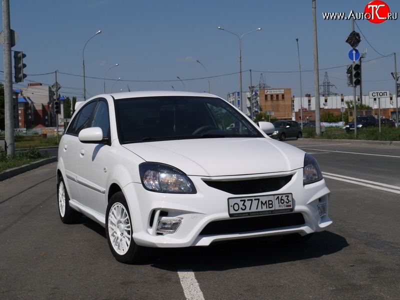 10 999 р. Передний бампер Vita Dm  KIA Rio ( 2 JB,  4 FB) (2005-2025) дорестайлинг седан, дорестайлинг, хэтчбэк 5 дв., рестайлинг, хэтчбэк 5 дв., рестайлинг седан (Без сетки, Неокрашенный)  с доставкой в г. Москва